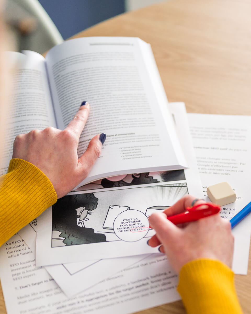 A professional proofreader checking a French manga.